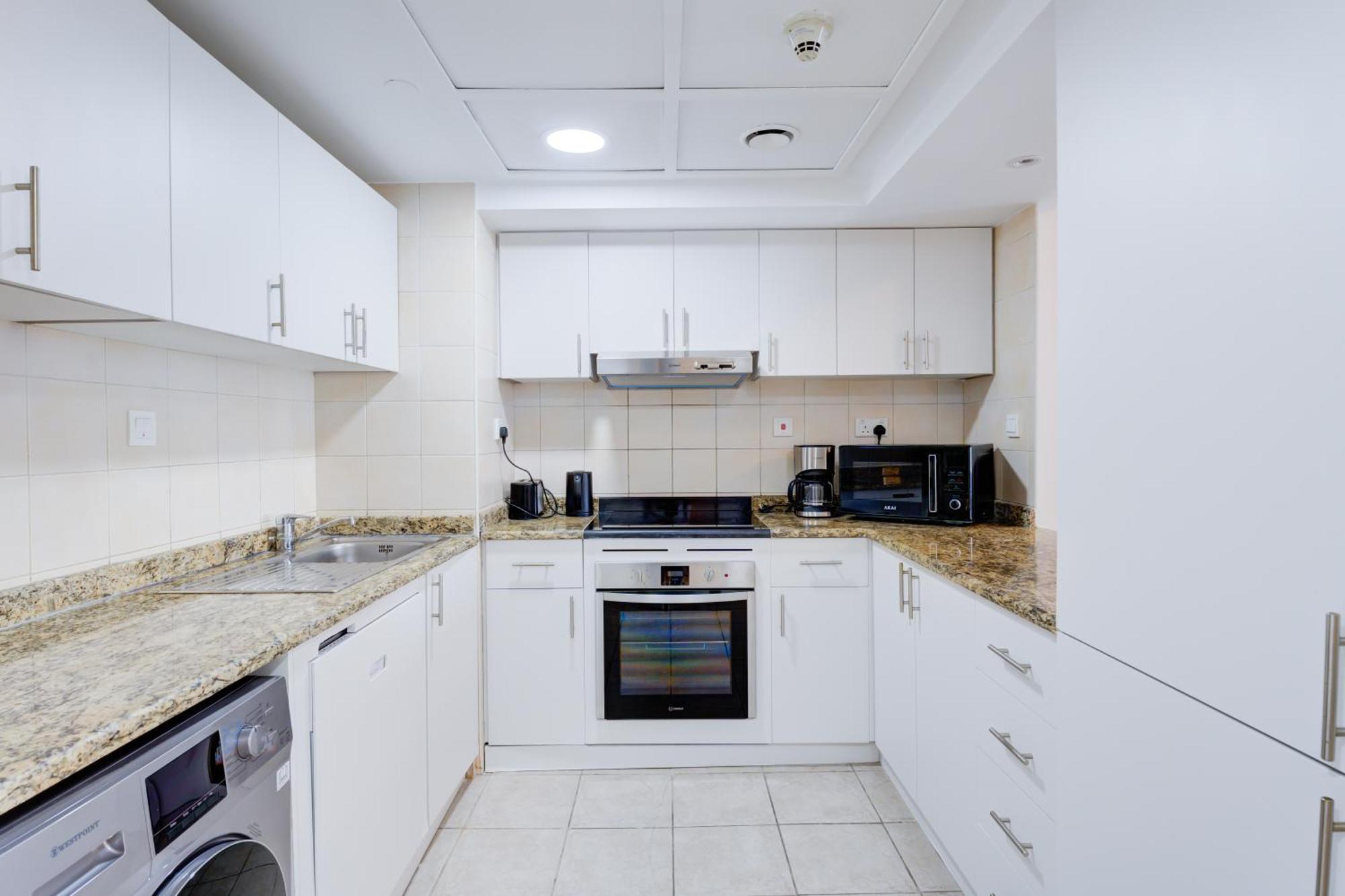 One-Bedroom Apartment with Balcony and Lake View - Shuttle Service to JBR Beach and Access to The Market Mall
