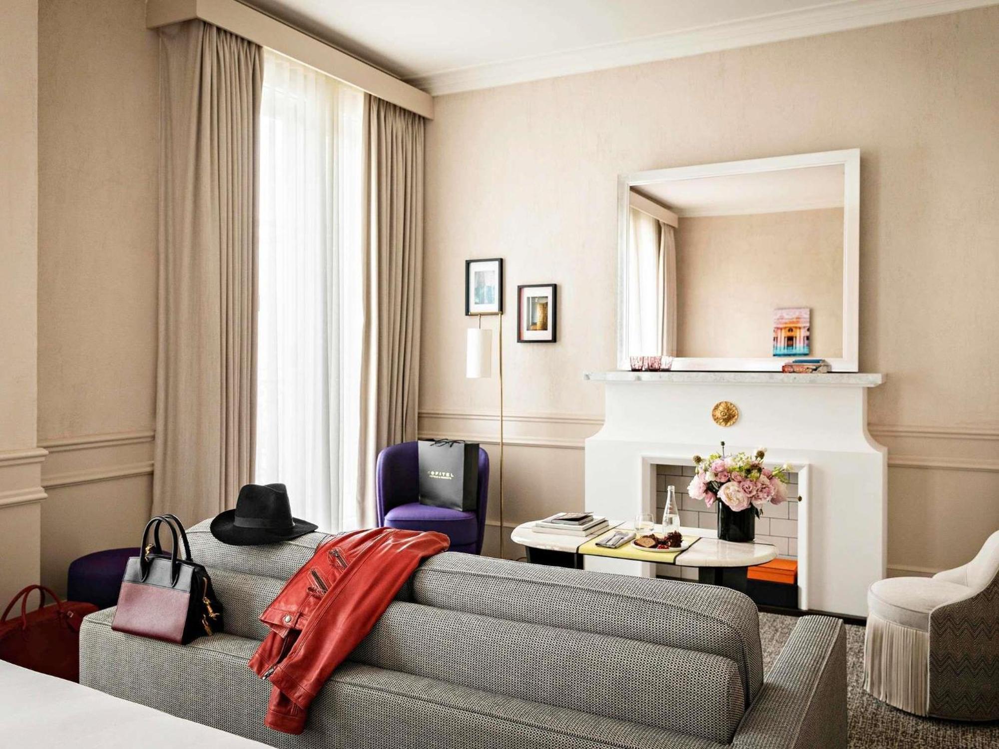 Junior King Suite One King Bed or One Sofa Bed Living Room Courtyard or Rue Scribe View